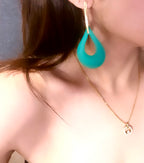 Turquoise teardrop earrings with natural turquoise stones and silver-toned frame