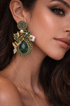 Green stone dangle earrings with emerald-toned gems and gold-plated hooks