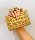 Handcrafted Golden Clutch — styled view