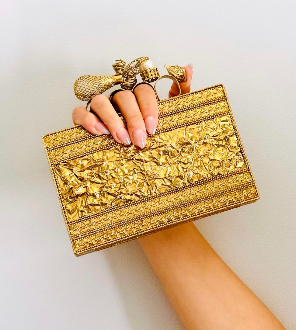 Handcrafted Golden Clutch — styled view