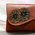 Handcrafted beaded leather purse with colorful bead detailing and leather body