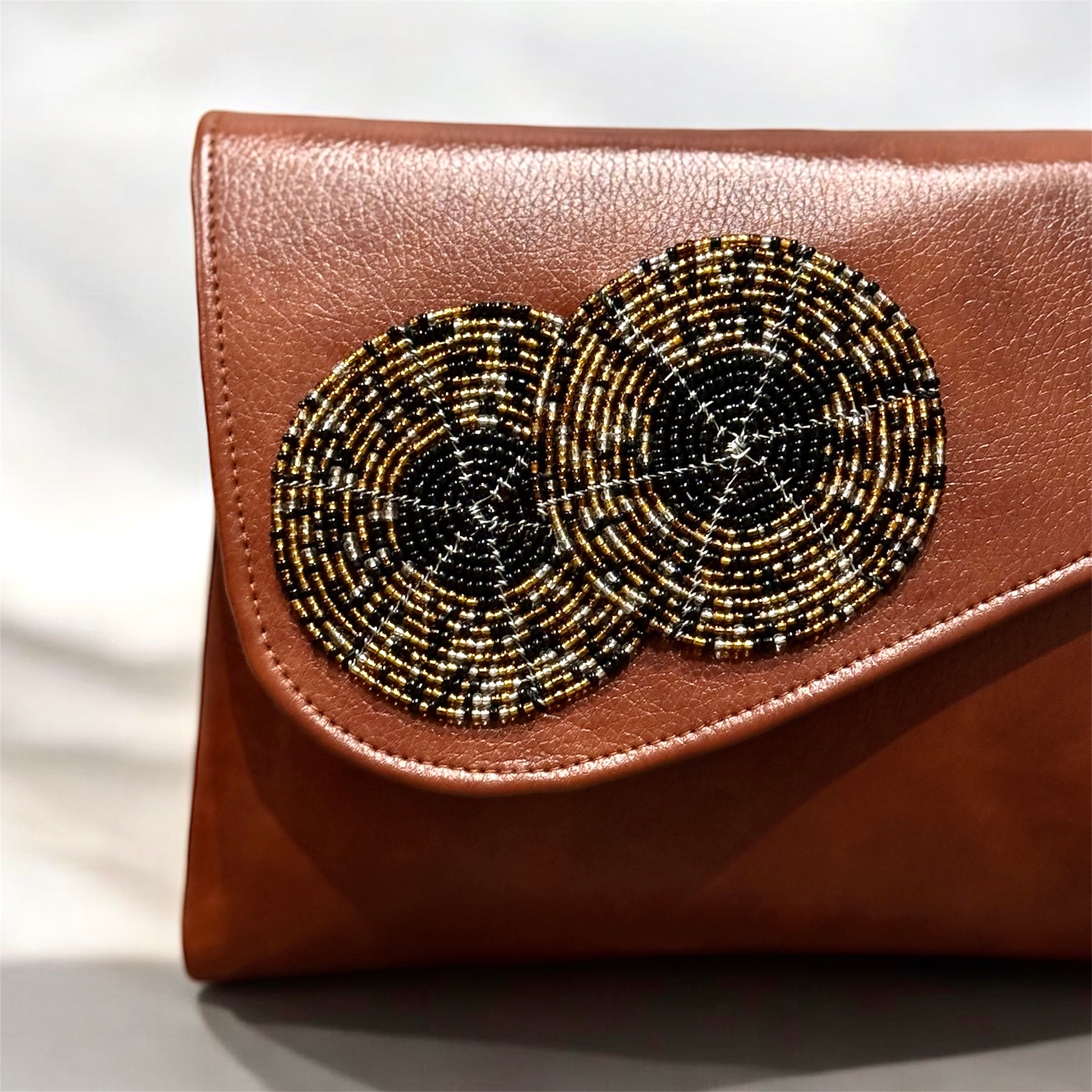 Handcrafted beaded leather purse with colorful bead detailing and leather body