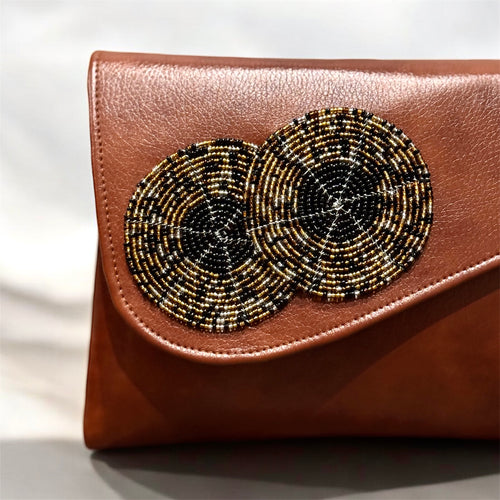 Handcrafted beaded leather purse with colorful bead detailing and leather body