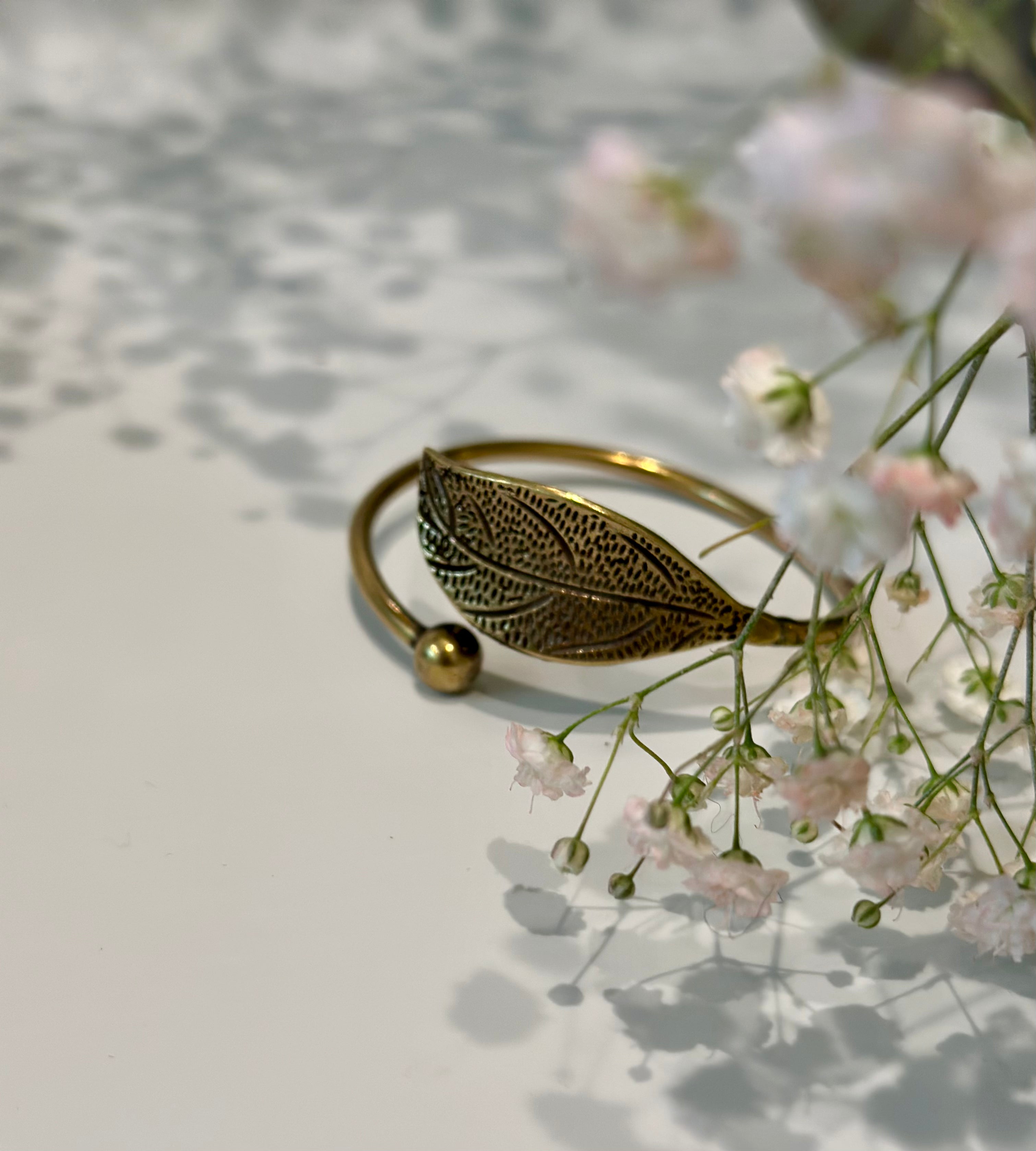 Handmade bronze leaf bracelet with detailed leaf motif and adjustable cuff