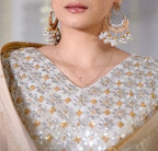 Pearl jhumka earrings with traditional bell shape and white pearl drops