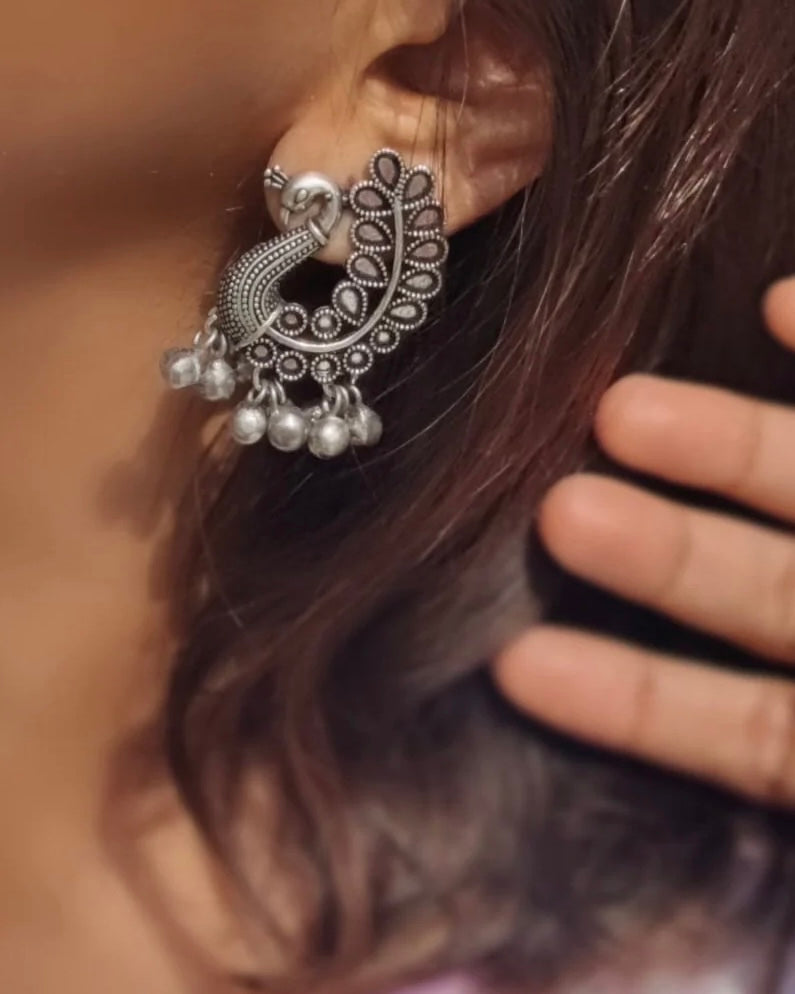 Silver stud jhumka earrings with traditional bell silhouette and oxidized finish