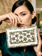 Handcrafted mother of pearl clutch bag with geometric mosaic pattern and gold handle