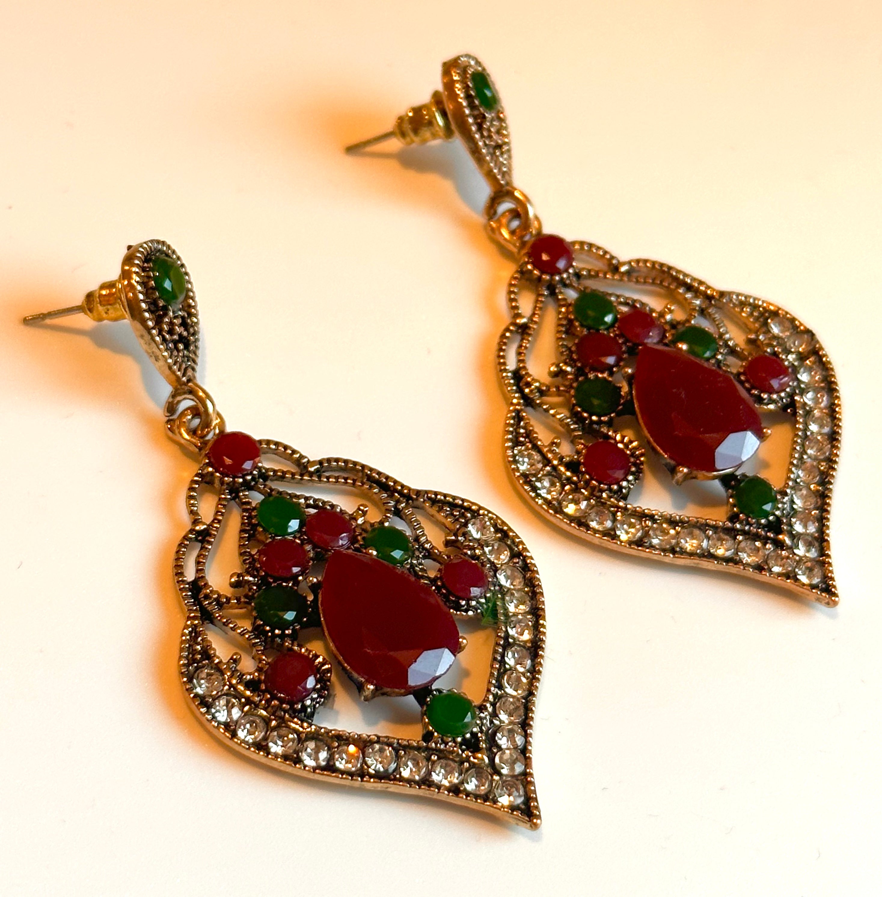 Timeless red charm earrings with ruby-toned stones and gold-plated hooks