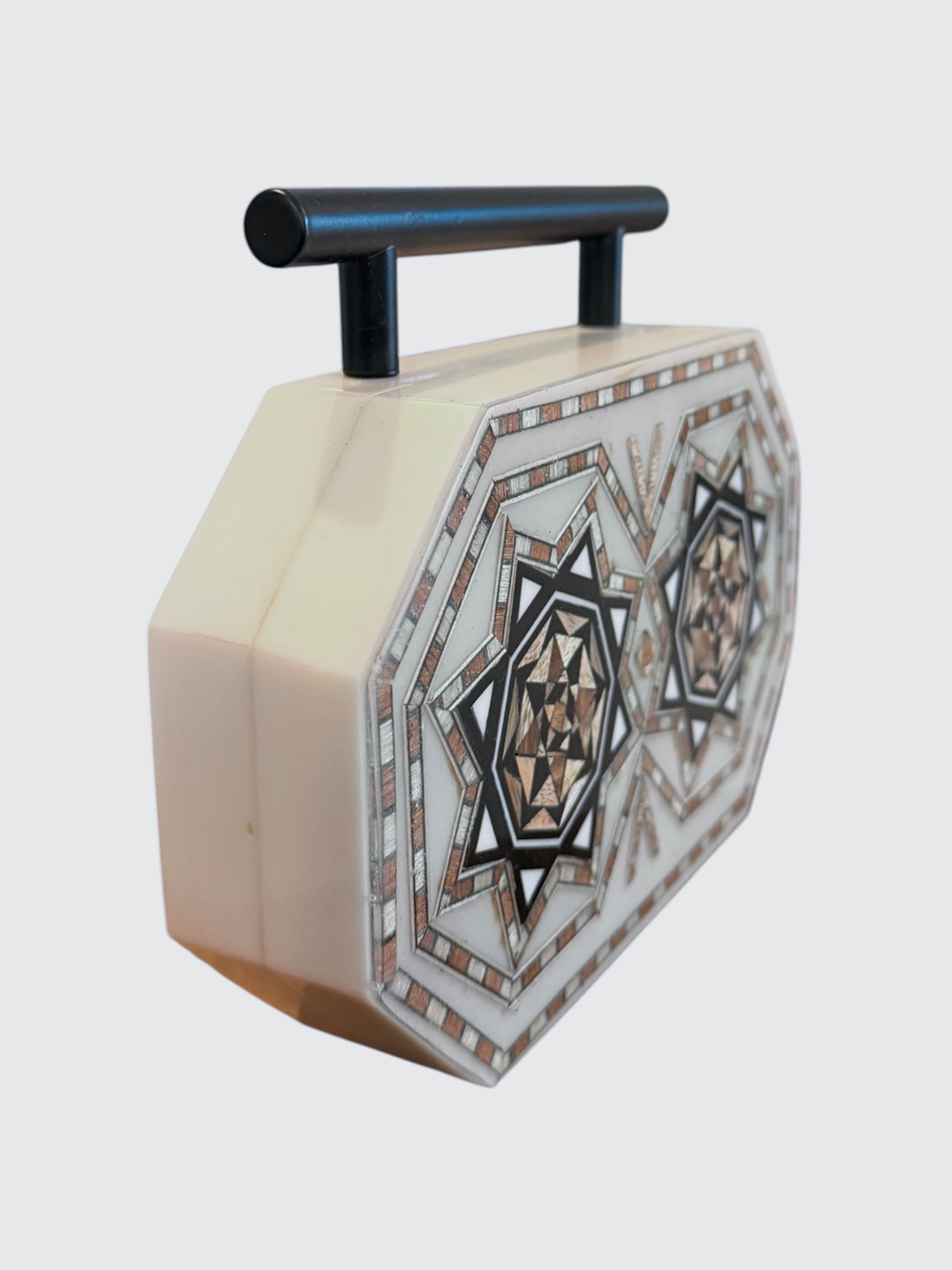 Decorative box with geometric pattern on a white background
