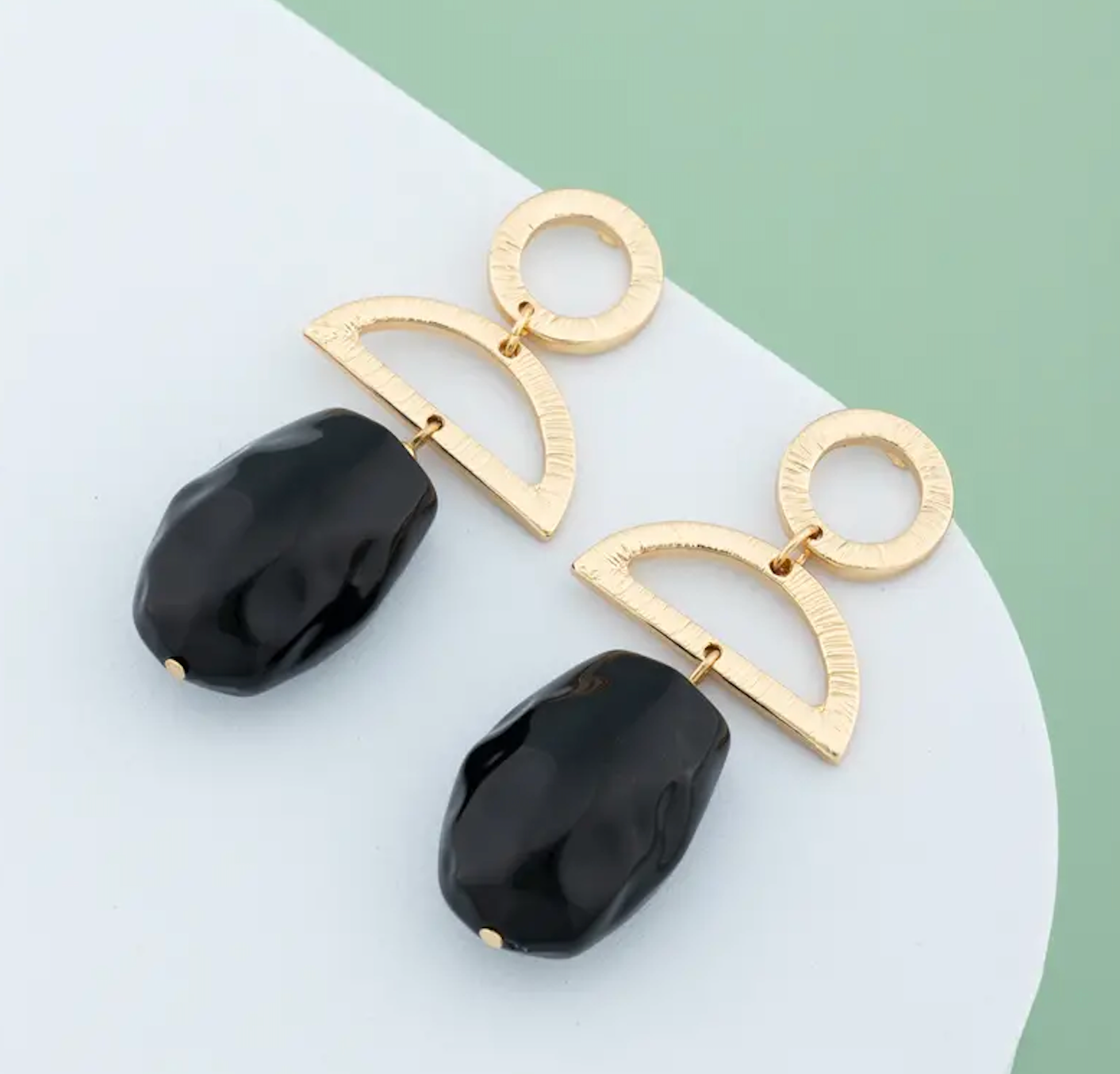 Black drop earrings with onyx-toned stones and sleek gold-plated hooks