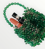 Green crystal beaded bag with emerald-toned beadwork and structured frame