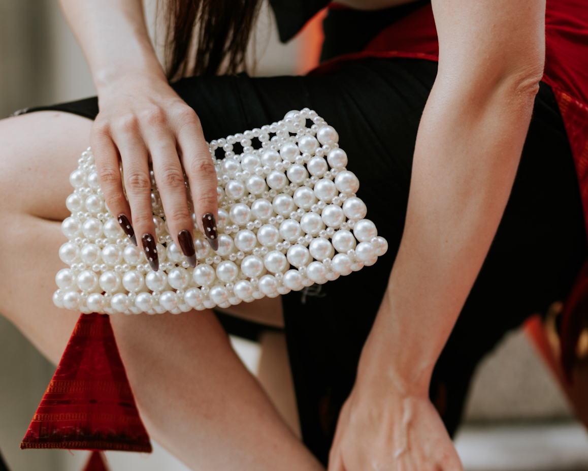 Carli pearl bag with white pearl beaded exterior and structured frame