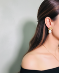 Mother of pearl drop earrings with natural shell discs and gold-plated hooks