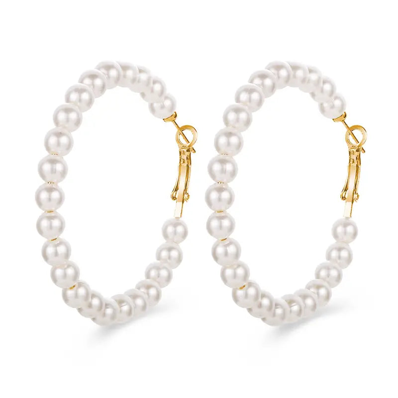 White pearl floral earrings with petal-shaped design and gold-plated studs