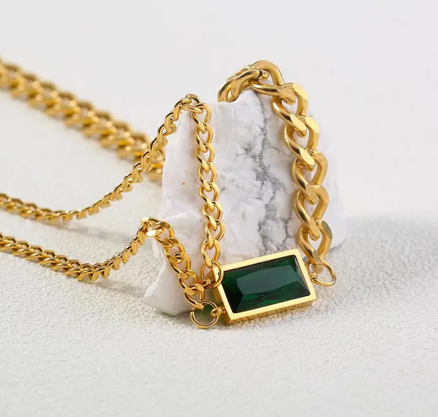 Green zircon pendant necklace with emerald-toned stone and gold-plated chain