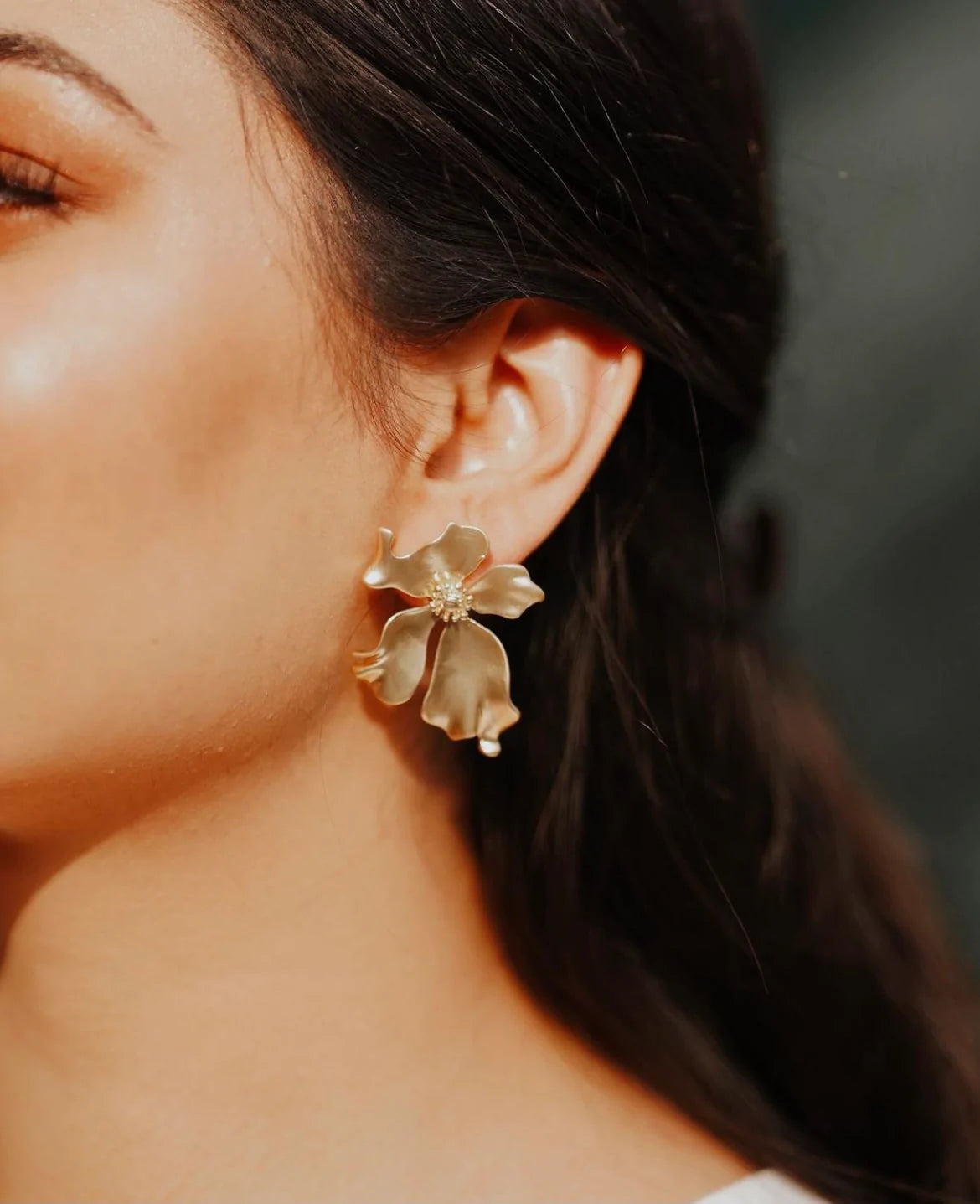 Floral stud earrings with delicate petal design and gold-plated posts
