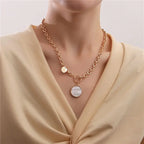 Mother of pearl chain necklace with natural shell pendant and gold-plated links